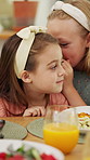 Food, secret and children at lunch in home with gossip, conversation or bonding together. Talking, health and girl kids at meal in dining room for confidential information, private story or whisper.