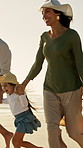 Parents, children and holding hands on beach with walk, smile or bonding together for summer holiday. Happy people, mother and father by ocean with girl kids, family vacation or travel for connection
