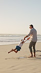Family, father and spin with girl at beach with smile, holding hands and bonding on summer vacation. People, children and space with connection, happy or ocean with games for fun on seaside holiday