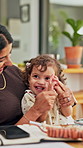 Mother, child and clapping hands for success in family home for playful fun, learning and win. Happy woman, toddler girl and laughing for play, applause or game with cheering, excited or first pump
