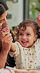 Mother, child and celebrate success in family home for playful fun, learning and winner. Happy woman, toddler girl and laughing for play, hands up or game with cheering, excited or first pump
