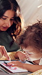 Tent, child and mother with tablet in home for internet scroll, educational app or playing online games. Love, woman and bonding with toddler in blanket fort for connection, development and learn
