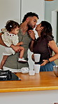 Phone call, kiss and couple with baby in kitchen for morning coffee, getting ready or family. Happy, bonding and girl child with mother and father on mobile conversation with cellphone in apartment.