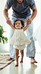 First steps, milestone and walking with in home with father, toddler and development or growth. Balance, learning or support with dad, man and excited child in bedroom for motor skills or movement