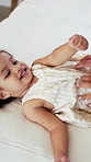 Hands, baby and parent with tickle on bed with bonding, above and connection with love in home. Child, girl and toddler with mom for stimulation, care and play with fun development at family house