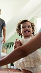 Steps, milestone and walking with in home with parents, toddler and development or growth. Balance, learning and support with mom, dad and excited child in living room for motor skills or movement
