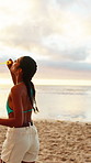 Bubbles, smile and freedom with woman at beach for summer vacation, energy and weekend break. Having fun, holiday getaway and sunset with female person outdoor for adventure, tropical and game