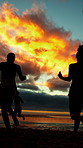Running, sunset and group of friends on beach for summer vacation, getaway or weekend trip together. Freedom, travel and people by ocean water for fun on seaside holiday with adventure in evening.