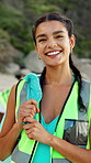 Clean up, woman and face of volunteer on beach for community, service or sustainability program. Happy, trash bag and portrait of NGO worker with social responsibility for waste management by ocean.