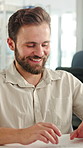 Happy, man and typing in office with laptop, positive feedback and email for product design proposal. Designer, person and smile in agency with computer, good news and research for creative project.