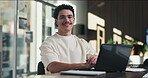Businessman, face and online with laptop in office, digital marketing or happy for assignment on web. Business, paid media specialist and person with tech for campaign, typing and laugh with project