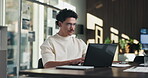Typing, online and businessman with laptop in office, digital marketing or happy for project on web. Business, paid media specialist and person with tech for trends research, glasses and ad campaign