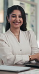 Smile, face or Indian woman in office with arms crossed, pride or ambition as investment advisor. Happy, portrait or financial consultant with laptop, confidence or about us in risk management.