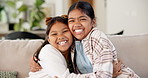 Sibling, face and children in home with hug, sister support or bonding together on weekend break. Smile, portrait and girls on sofa with embrace, family connection and healthy relationship in house.