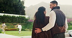Hug, playing and family with children in backyard for home, weekend or holiday together. Happiness, talking and back people or mom and dad with bonding, comfort or love for kids running on property