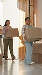 Parents, children and walking with boxes in new home for property investment, moving in or security. Happy, family or kids with cardboard at front door for real estate, mortgage success or relocation