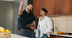 Clipboard, pointing and plumber with woman in kitchen with planning for maintenance or repairs in house. Checklist, discussion and contractor with female customer for renovation in home with service.