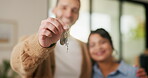 Hands, couple and happy with keys to new home for property purchase, moving in and marriage goals. Real estate, people or embrace with keychain for dream house, investment pride or relocation support