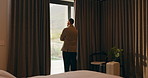 Hotel, window and businessman with arms crossed, idea and plan for investment or decision in bedroom. Motel, business travel and person with ambition for financial growth, back and thinking of future