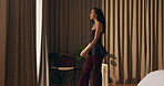 Thinking, walking and window with woman in hotel room for holiday, hospitality or travel. Idea, luggage and morning view with thoughtful guest in lodge or resort for break, getaway or vacation