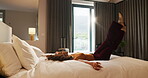 Travel, hotel and woman jump on bed for vacation, tired and relax with room hospitality. Excited, happy and person leap on soft mattress for comfort, luxury and break on holiday, trip or weekend
