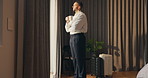 Hotel, window and businessman with coffee, thinking and planning for future and investment decision. Drinking, tea and person with ambition in bedroom, entrepreneur and reflection for business growth