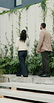 Tablet, client or realtor with backyard tour for exterior features, landscaping or assessment. Tech, real estate agent and man with discussion at house for private viewing, garden inspection or back
