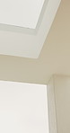Ceiling, skylight or architecture in home with white wall, interior or minimalistic design for building. Modern aesthetic, roof and plaster shaft with window, house and natural lighting for property.