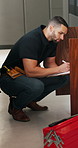 Plumbing, repair and man with clipboard in kitchen for inspection, evaluation and handyman quote. Home, plumber and person with checklist for maintenance, installation and damage for leaking pipe