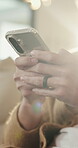 Hands, typing and chat with phone, home and communication with contact on social media or networking. Internet, connection and person with mobile for message, flare and texting with tech in house
