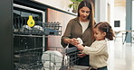 Dishwasher, cleaning and mother with child in kitchen for learning, teaching or housework at home. Family, woman and girl with dirty dishes in machine for chores, hygiene or helping for development