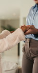 Mom, child and holding hands in living room with dance, trust and bonding together for weekend break. Mother, young daughter smile and play in home with rhythm, music or support for family connection
