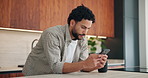 Phone, happy and man in kitchen for texting, networking or contact on mobile app in morning. Technology, smile and male person with cellphone for social media or connectivity on website in house.