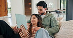 Tablet, relax and couple on sofa in home with laugh for funny meme on social media, texting or website. Happy, digital technology and man with woman in living room for humor with online joke in house