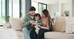 Parents, child and tablet with game on sofa for problem solving, development or bonding activity. Learning, family or kid with tech in home for playing online puzzle, digital literacy or relationship