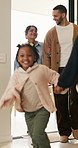 Happy, family and new home with children running for moving in, relocation or property investment. Mom, dad and excited kids playing with smile in house for safety, security or protection together