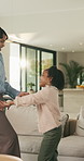 Mom, daughter and holding hands in house with dance, trust and bonding together for fun weekend break. Mother, child smile and play in living room with rhythm, music and support for family connection