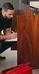 Man, plumber or writing with inspection in home for repair, fix or consultation quote. Male person, handyman and checklist with invoice or form for maintenance, fault finding or installation in house