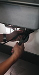Person, hands and plumber with wrench for pipe leak, repair service or fixing sink in home. Handyman, tinker or adjustment with basin for water flow, plumbing maintenance or installation in house