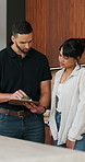 Clipboard, planning and plumber with woman in kitchen for discussion on repairs or maintenance. Conversation, checklist and contractor with female client for renovation, service or report in home.