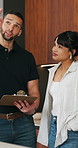 Clipboard, pointing and plumber with woman in kitchen for discussion on repairs or maintenance. Planning, checklist and contractor with female client for renovation, service or report in home.