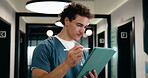Healthcare, nurse and tablet with pen in hallway for hospital archive, treatment plan or checklist. Professional, man and health app with stylus for insurance records, review diagnostics and results