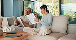 Couple, laptop or finance with documents on sofa for bills, expenses or investment in home. Man, woman or paperwork with computer for financial planning, budget cost or invoices together in house