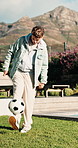 Teenager, exercise and ball in backyard for soccer fitness, practice juggling and footwork skills. Active, boy and freestyle training for football tricks, sports activity and weekend hobby at house