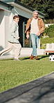 Father, playing and child with ball in backyard for soccer, friendly match and scoring goal. Man, teenager and energy for football game, family competition and celebration for winning contest in home