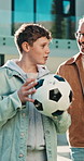 Soccer ball, father and child walk for care, bonding and conversation for connection in backyard. Football, dad and kid outdoor for love, smile and talking about sports with parent for support