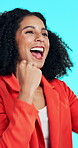 Deal, fist pump and success with woman in studio for celebration of goals or target as winner. Announcement, opportunity and yes with excited person on blue background for cheering or satisfaction