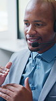 Man, mic and talking in call center for telemarketing, finance advice and problem solving. Black person, insurance agent and headset in office for communication, policy FAQ and outbound calls