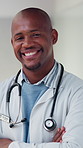 Doctor, healthcare and black man with smile, portrait and cardiology specialist with career ambition. African person, arms crossed and professional in hospital for wellness, medical service and pride
