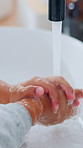 Tap, water and child washing hands in bathroom with disinfection, wellness and bacteria prevention. Kid, cleaning skin and dirt removal in home with hygiene, healthy habits and protection from germs.